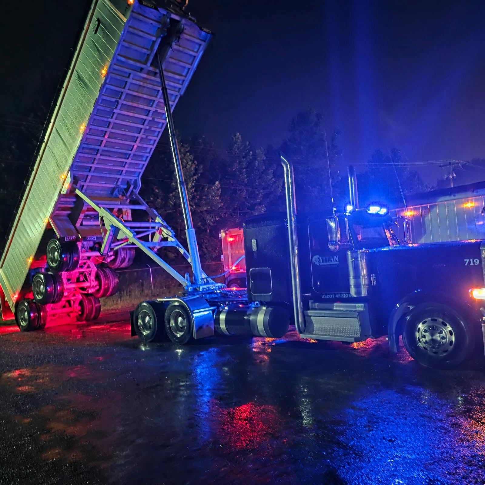Titan end dump raised at night