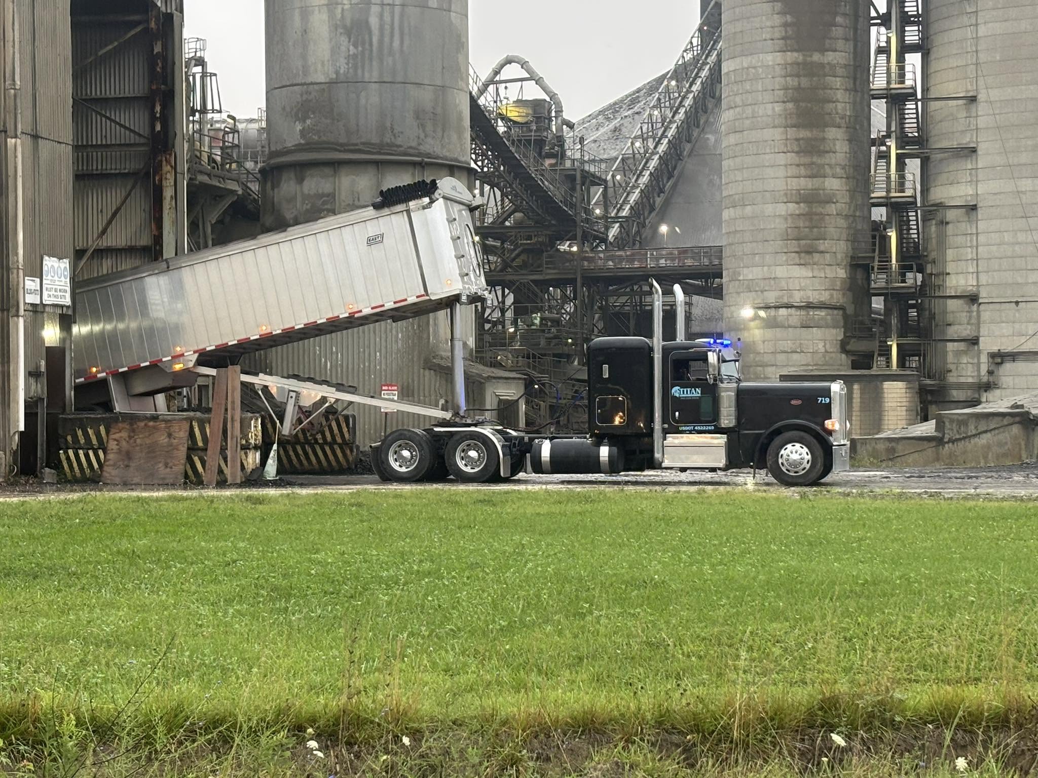 Titan end dump unloading at an industrial facility