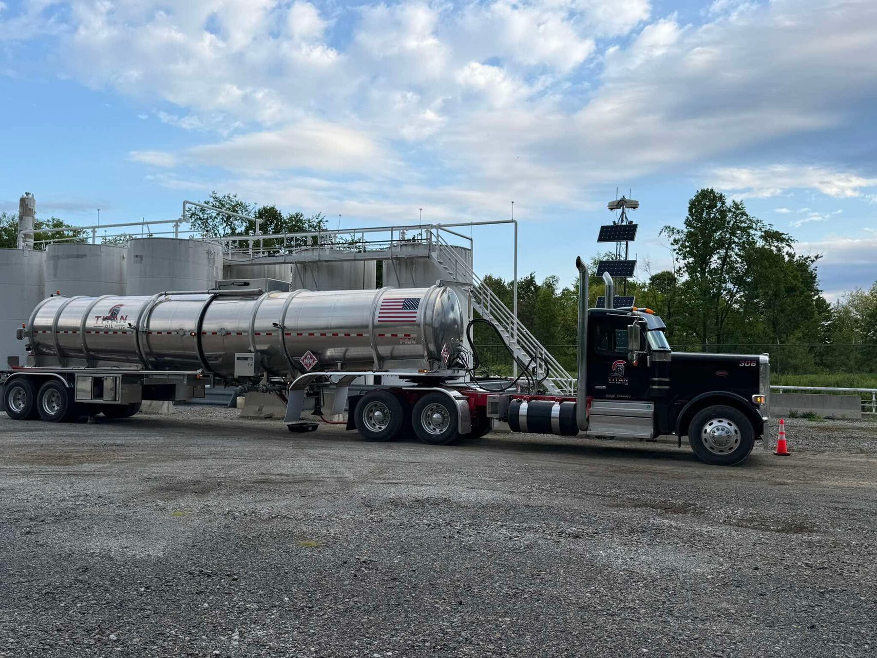 Titan Oil truck 306 loading at a tank battery