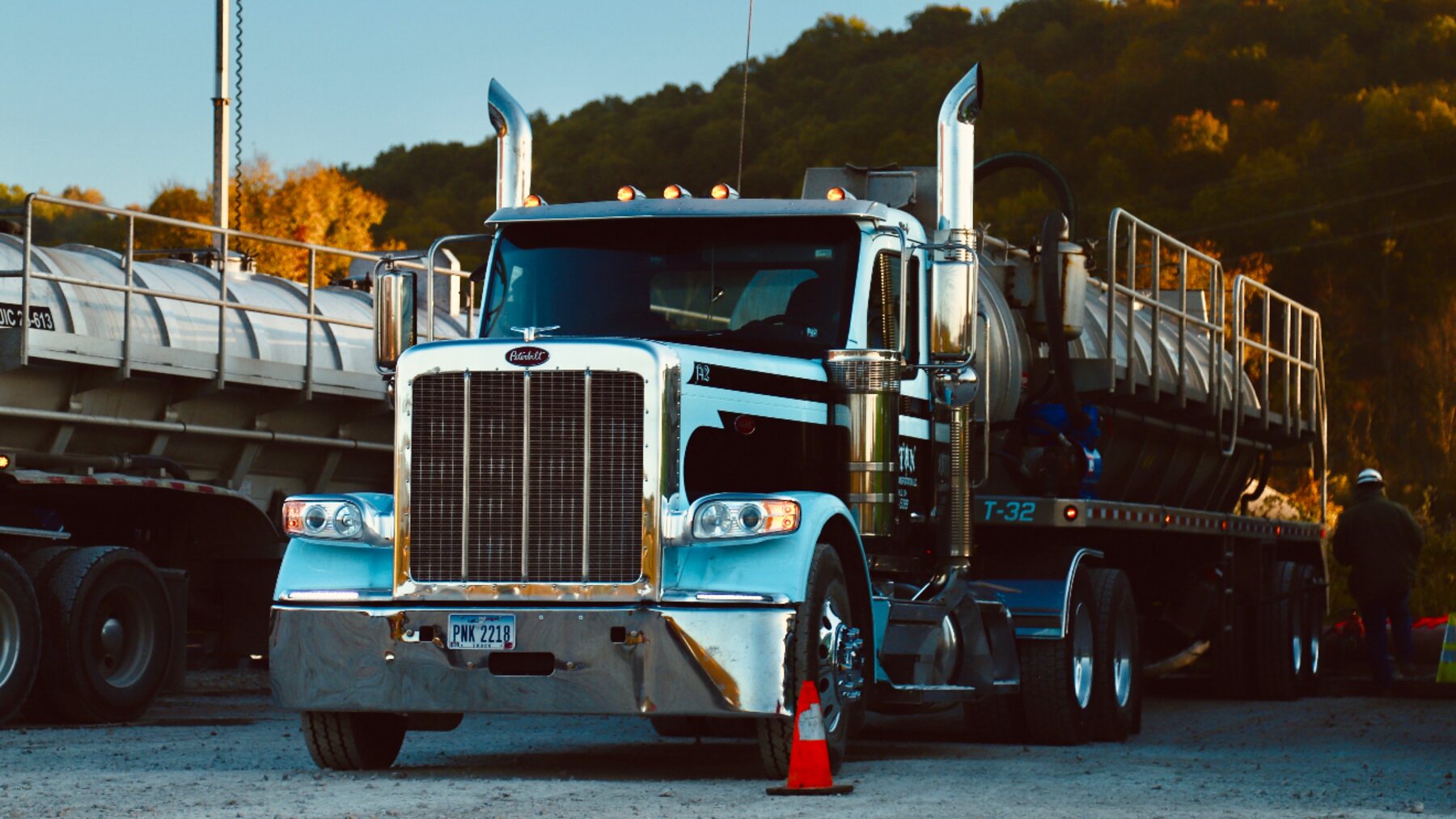 Titan water truck with vacuum trailer in evening light